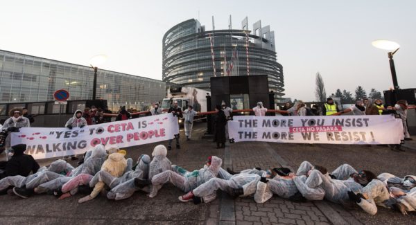 Protesters block access to the European Parliament with banners during a protest against the Comprehensive Economic Trade Agreement (CETA) between the EU and Canada, in front of the European Parliament in Strasbourg, France, 15 February 2017. 